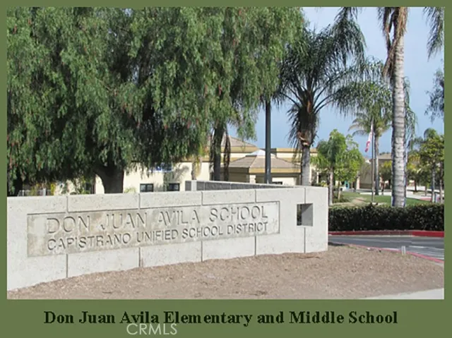 a view of outdoor space with a garden and signage