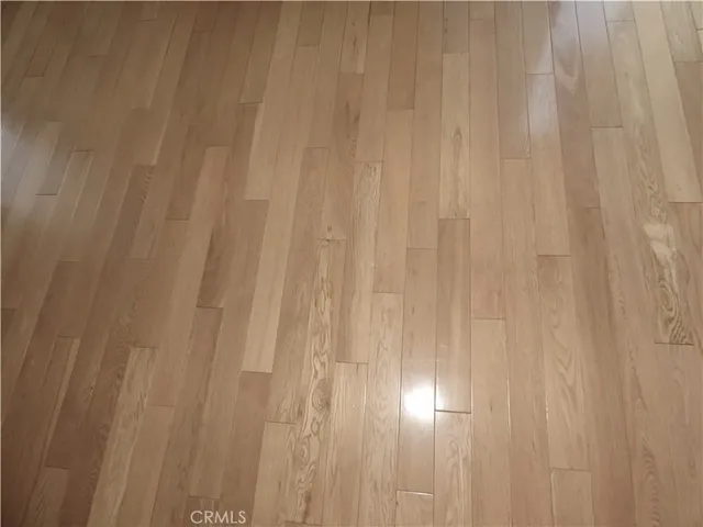 a view of empty room with a fireplace