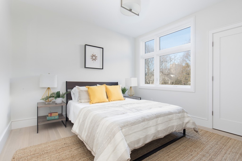 9 Decatur Street, Unit 1 Cambridge, MA 02139 - Photo 6 of 12 a bedroom with a bed and a window