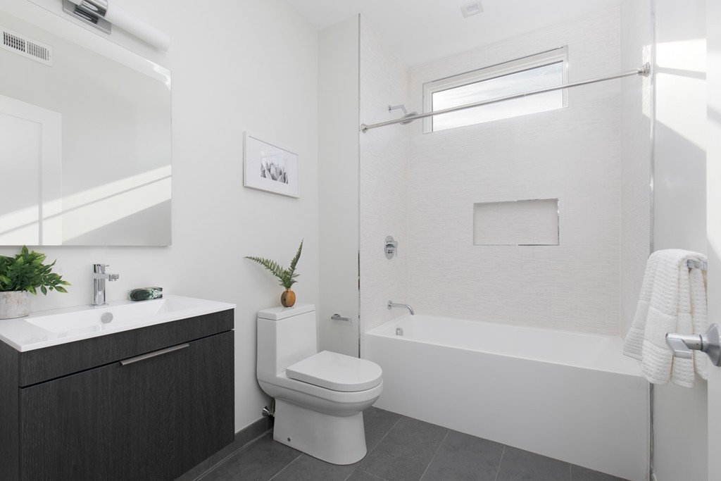 9 Decatur Street, Unit 1 Cambridge, MA 02139 - Photo 7 of 12 a bathroom with a toilet sink and shower