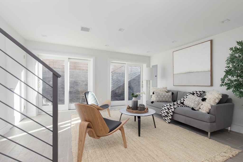 9 Decatur Street, Unit 1 Cambridge, MA 02139 - Photo 8 of 12 a living room with furniture and a large window