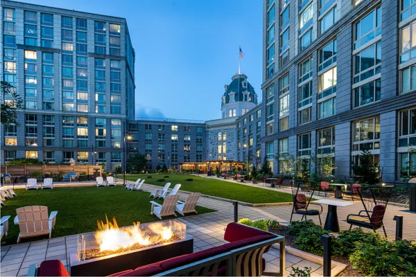 a view of a building from a big yard