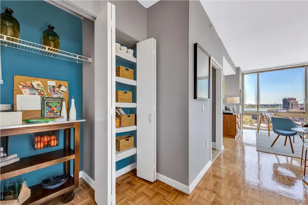 a view of a livingroom with furniture and workspace