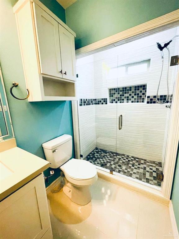 209 West Rutherford Avenue, Unit 4 Edinburg, TX 78541 - Photo 13 of 14 a bathroom with a sink and a toilet