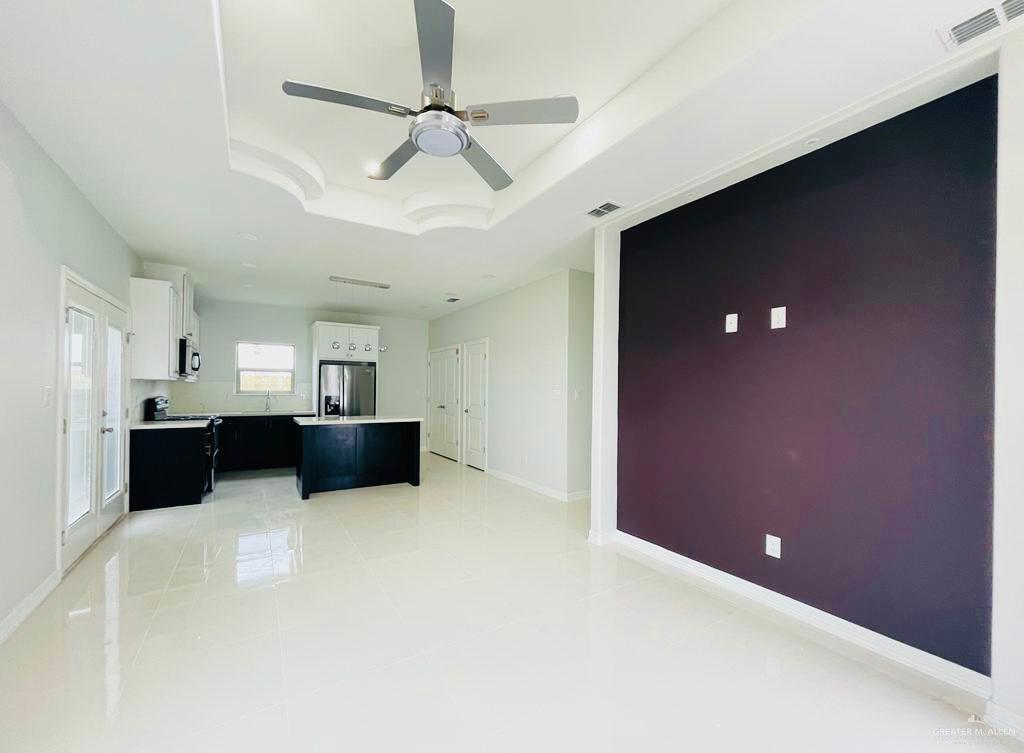 209 West Rutherford Avenue, Unit 4 Edinburg, TX 78541 - Photo 6 of 14 a view of a livingroom with a furniture and a ceiling fan