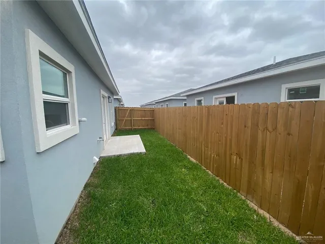 a view of a back yard of the house