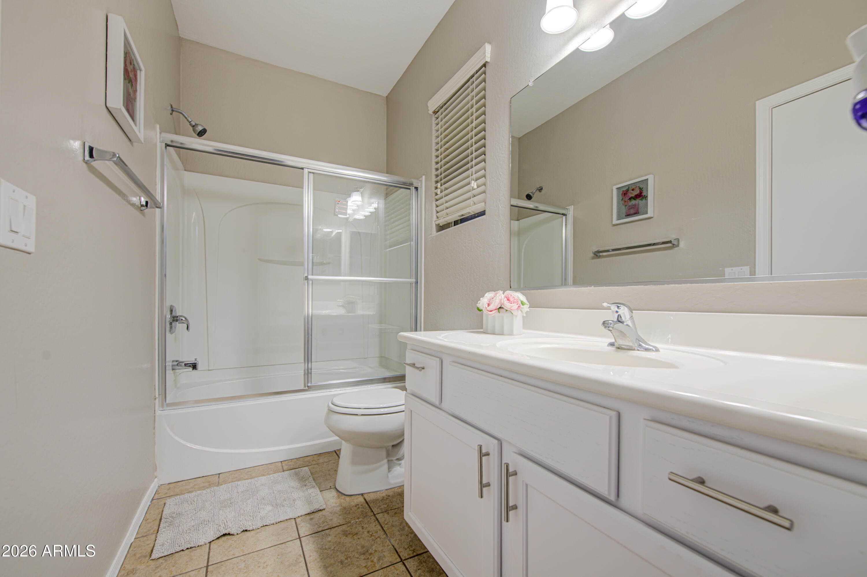 7759 West Monte Vista Road Phoenix, AZ 85035 - Photo 36 of 43 a bathroom with a sink a toilet and shower