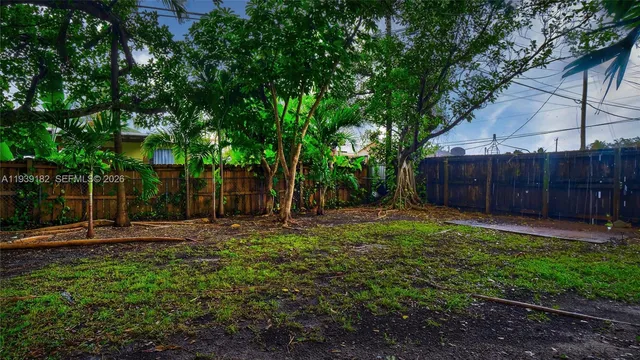 a backyard of a house with lots of green space