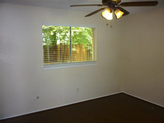 a view of a chandelier fan and a table