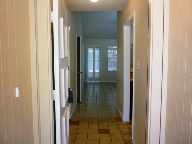 a bathroom with a glass door shower