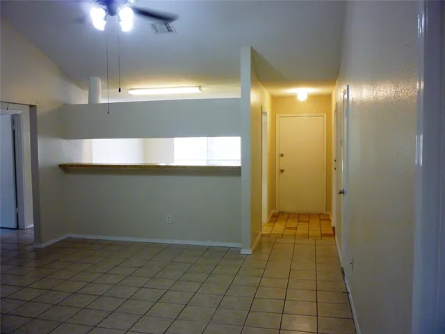 a kitchen with granite countertop a sink and a stove