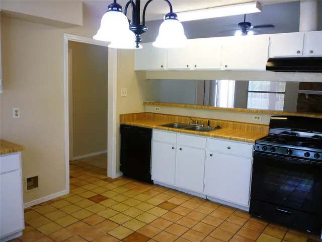 a kitchen with sink and window