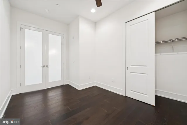 an empty room with wooden floor