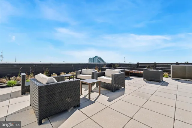 a view of terrace with seating area and barbeque oven