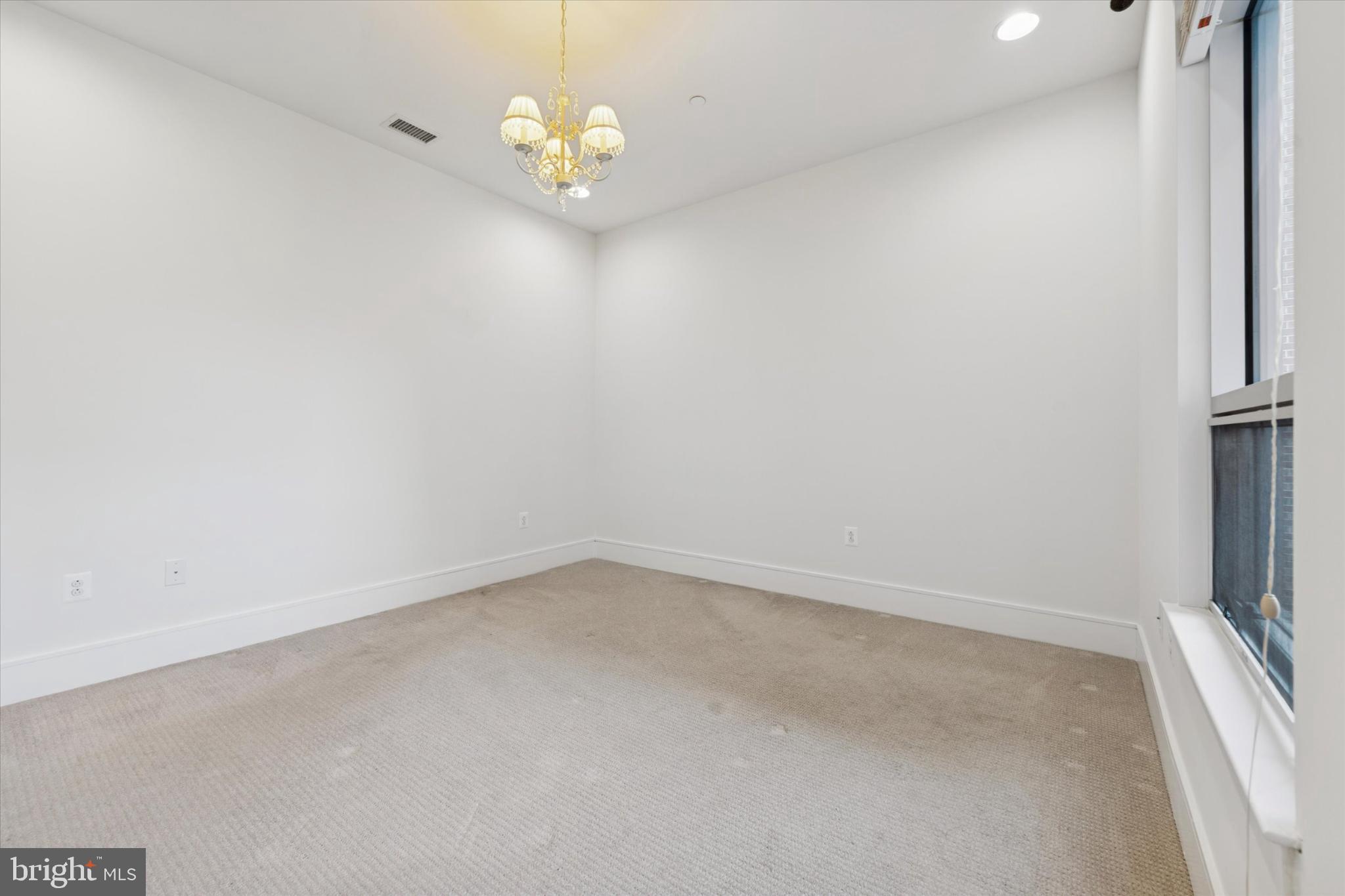 410 South Front Street, Unit 313 Philadelphia, PA 19147 - Photo 9 of 24 a view of empty room with wooden floor