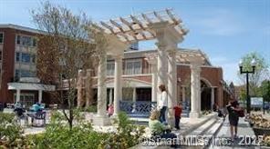 15 Dinah Road, Unit 223 West Hartford, CT 06107 - Photo 28 of 36 a view of a building with a fountain in a yard