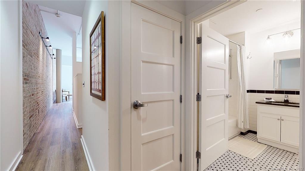 15 Dinah Road, Unit 223 West Hartford, CT 06107 - Photo 3 of 36 a bathroom with a shower and a sink