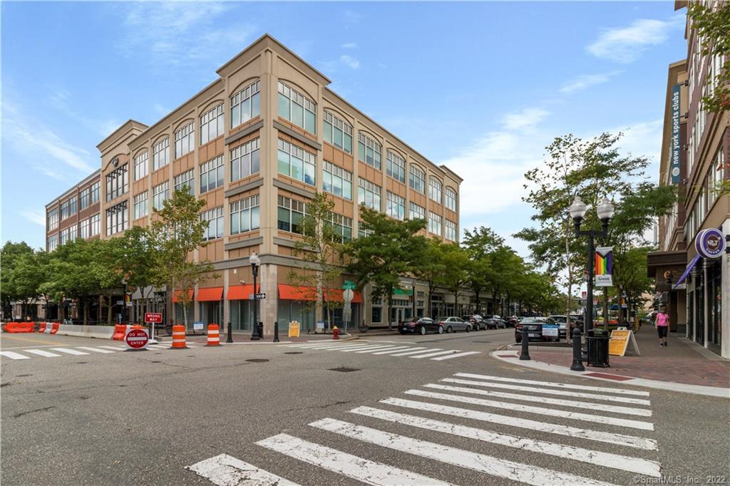 15 Dinah Road, Unit 223 West Hartford, CT 06107 - Photo 34 of 36 a city street lined with buildings and cars