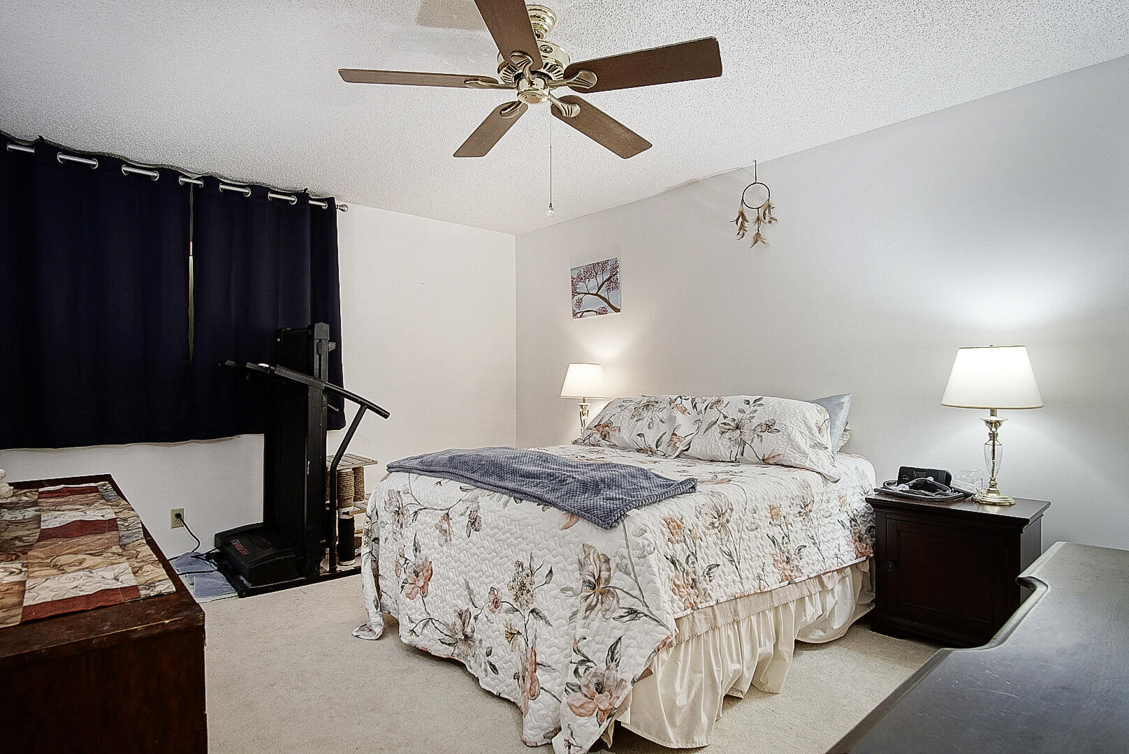 5930 Whispering Pine Way, Unit C2 Greenacres, FL 33463 - Photo 11 of 20 a bedroom with a bed and a lamp