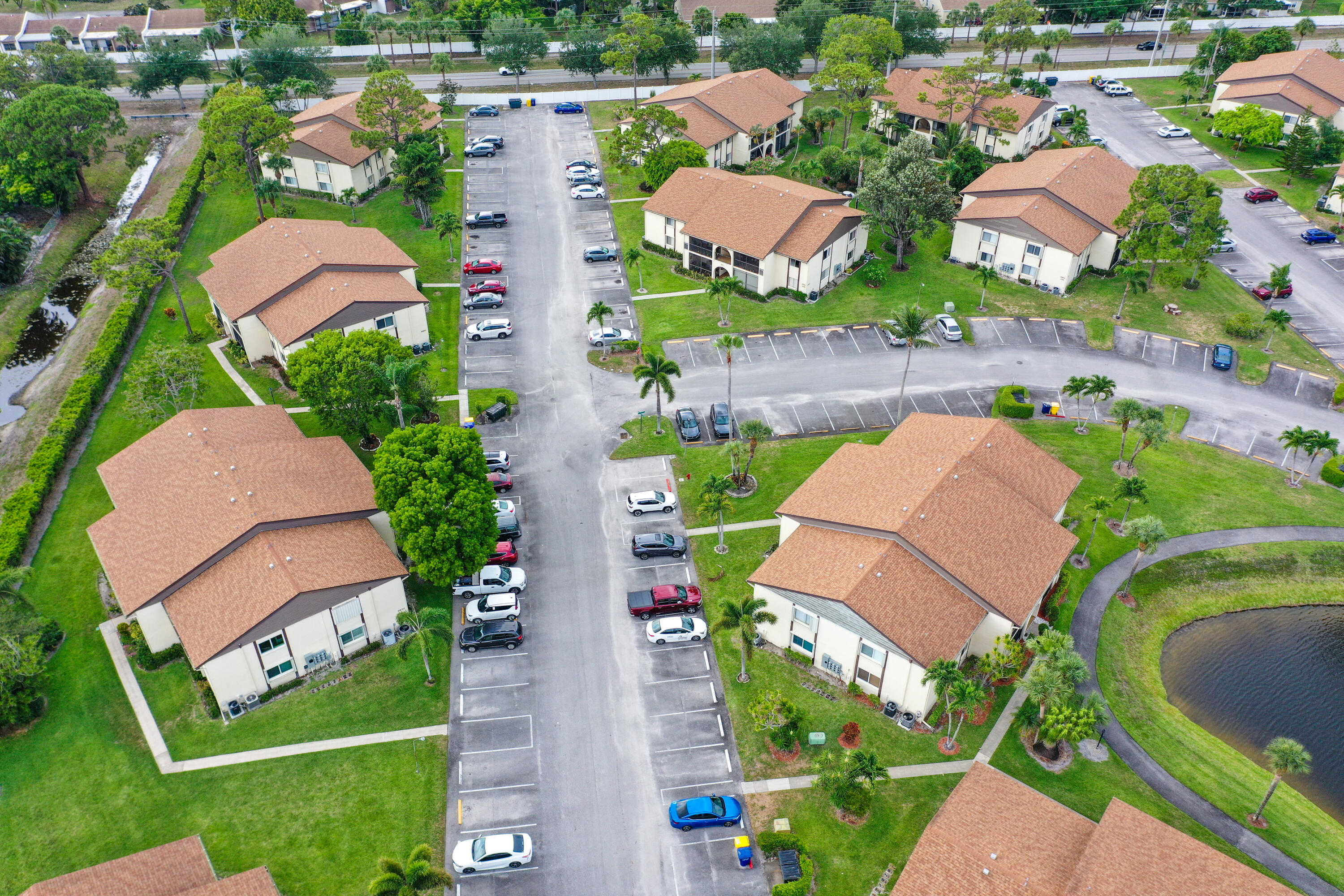 5930 Whispering Pine Way, Unit C2 Greenacres, FL 33463 - Photo 20 of 20 an aerial view of residential houses with outdoor space and street view