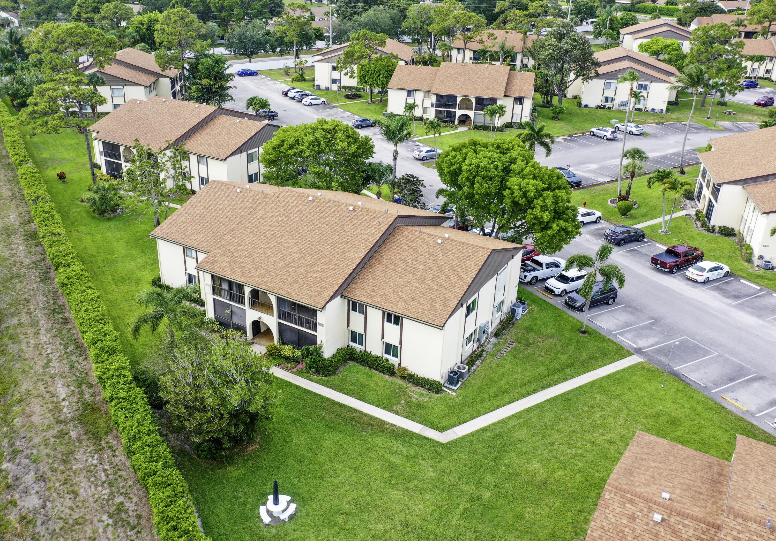 5930 Whispering Pine Way, Unit C2 Greenacres, FL 33463 - Photo 2 of 20 an aerial view of a house