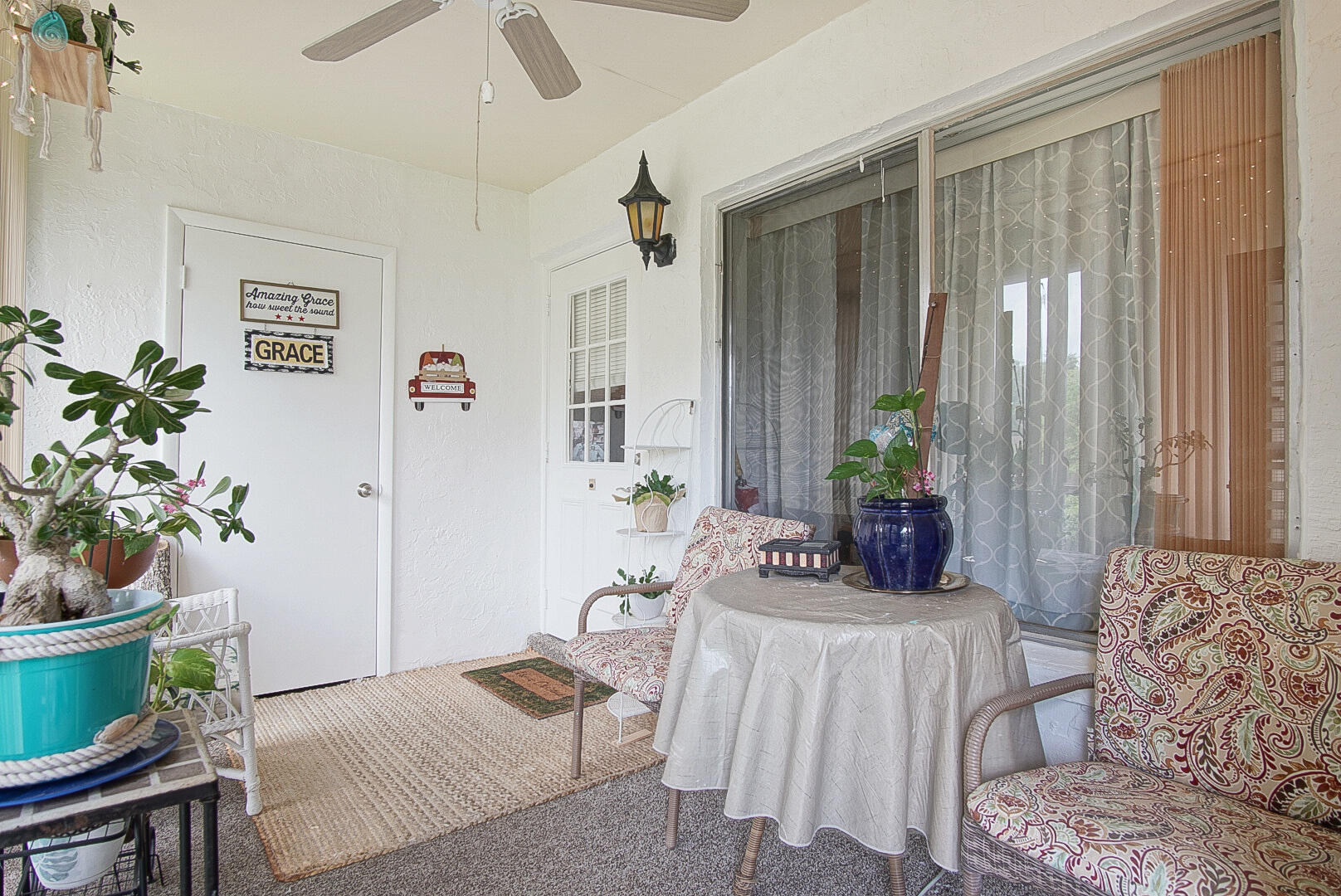 5930 Whispering Pine Way, Unit C2 Greenacres, FL 33463 - Photo 3 of 20 a living room with furniture and a potted plant