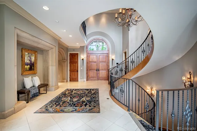 a living room with furniture fireplace and a large window