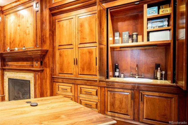 a spacious bedroom with a bed and a chandelier