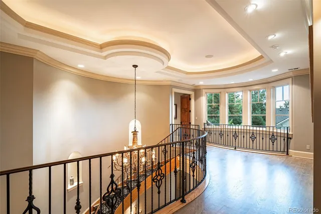 a bedroom with a bed and glass windows