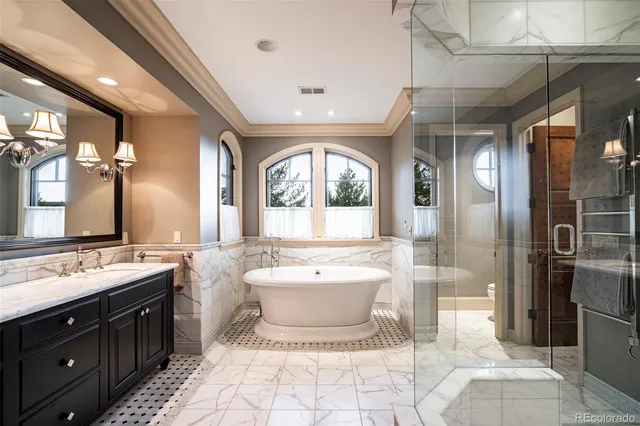 a bathroom with a bathtub and a shower