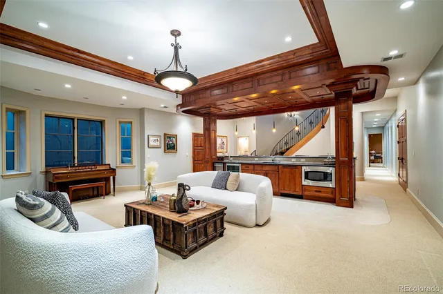 a kitchen with stainless steel appliances kitchen island granite countertop a stove and a sink