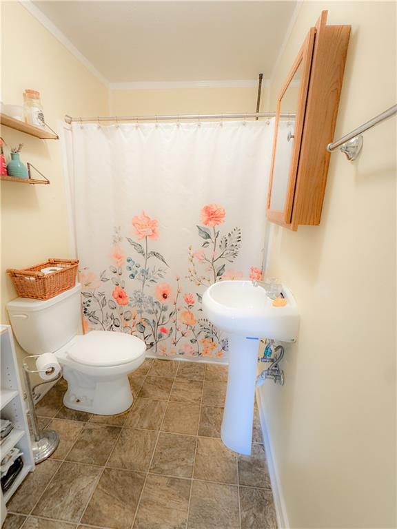 225 Jasper Street Fairmount, GA 30139 - Photo 12 of 15 a bathroom with a sink toilet and shower