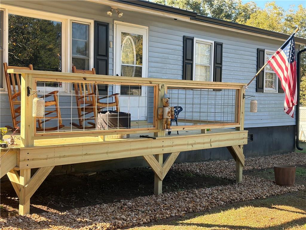 225 Jasper Street Fairmount, GA 30139 - Photo 2 of 15 a view of a house with pool and chairs