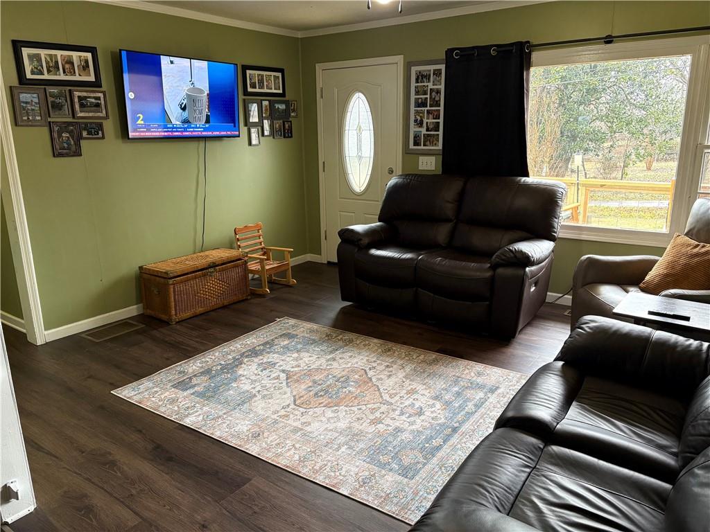 225 Jasper Street Fairmount, GA 30139 - Photo 4 of 15 a living room with furniture rug and wooden floor