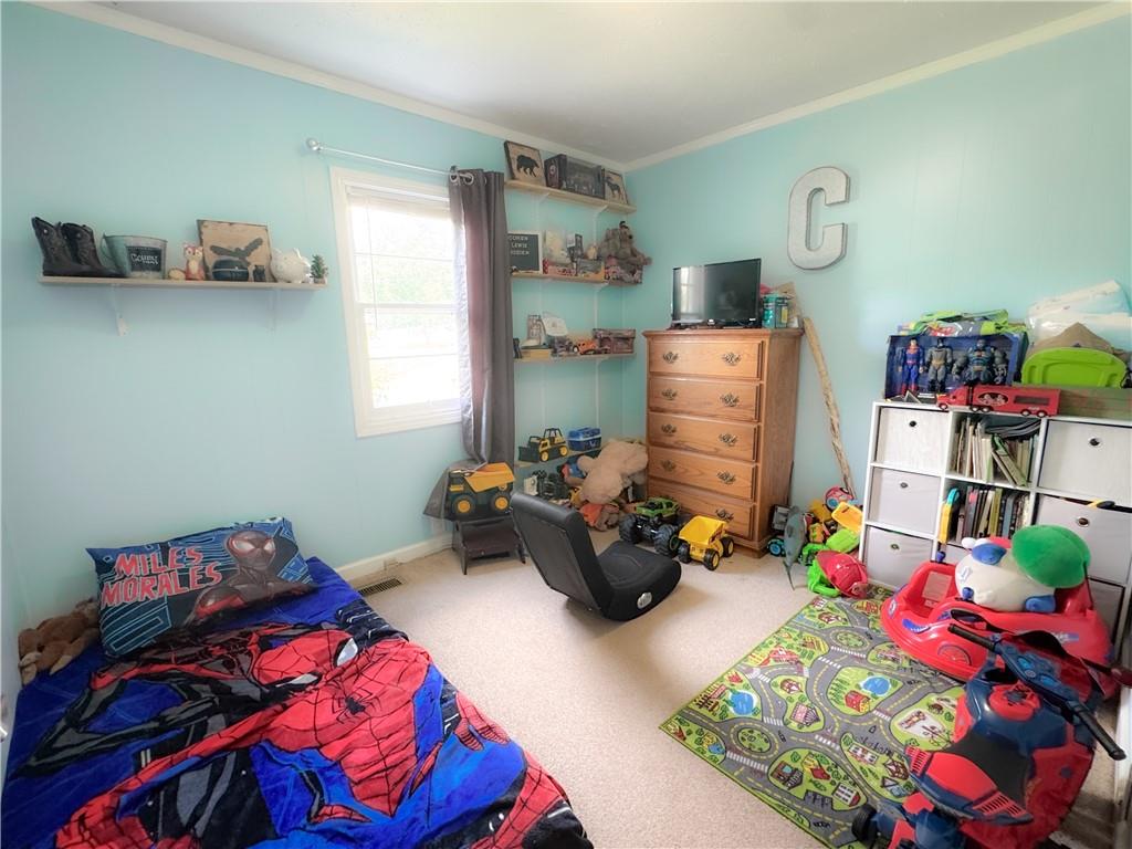 225 Jasper Street Fairmount, GA 30139 - Photo 10 of 15 a bedroom with bed and a couch