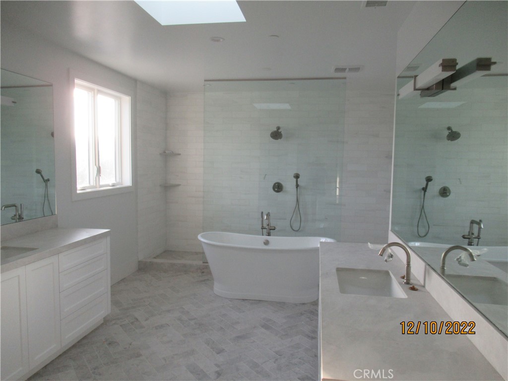 1300 11th Street Manhattan Beach, CA 90266 - Photo 13 of 19 a bath room with a sink tub and a bathroom