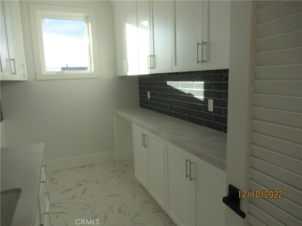 1300 11th Street Manhattan Beach, CA 90266 - Photo 19 of 19 a bathroom with a sink and a washing machine