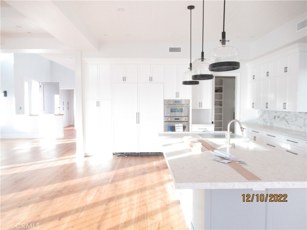 1300 11th Street Manhattan Beach, CA 90266 - Photo 9 of 19 a bathroom with a sink and a mirror