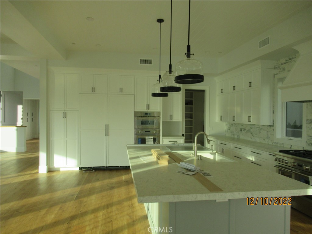 1300 11th Street Manhattan Beach, CA 90266 - Photo 10 of 19 a bathroom with a sink and a mirror