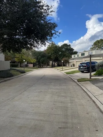 a view of a road with a yard