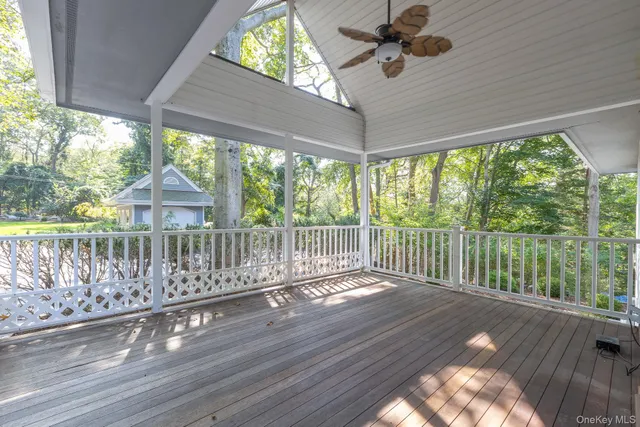 a view of a balcony with wooden floor