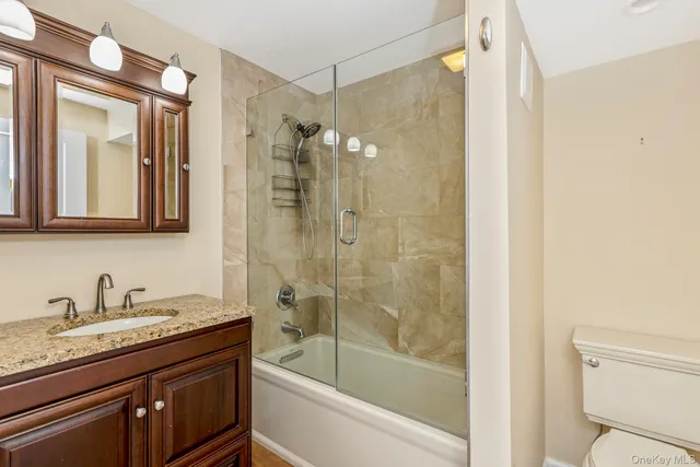 a view of house with a yard and garage