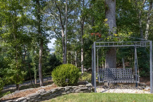 a view of a house with sitting area and garden