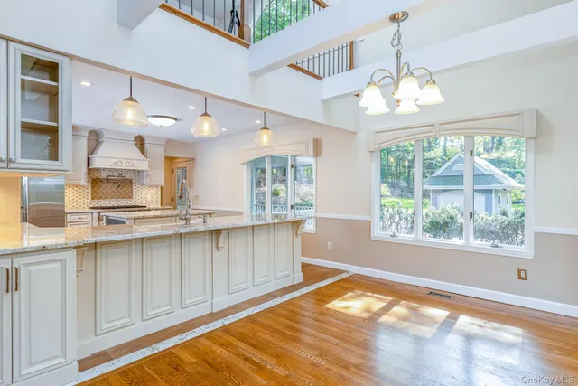 a view of a kitchen with marble kitchen and dining room