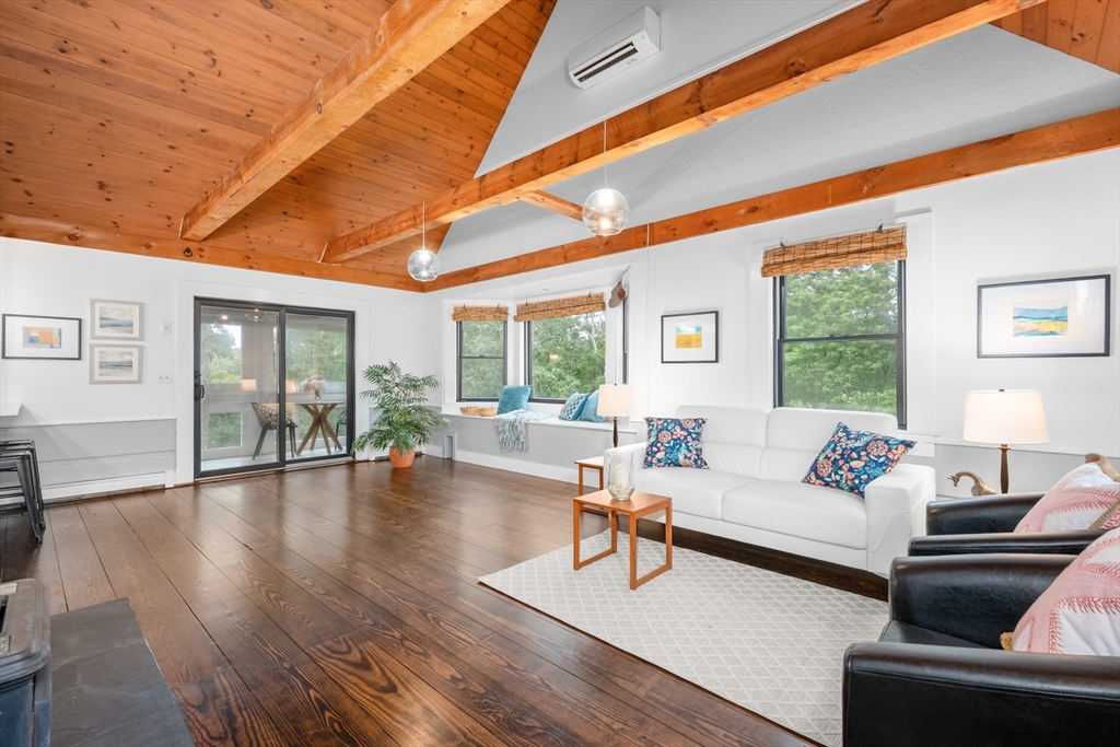 24 Chickadee Circle Chatham, MA 02633 - Photo 1 of 41 a living room with furniture and a large window