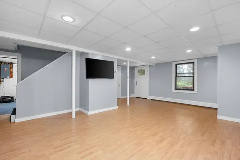 a view of an empty room with a flat screen tv