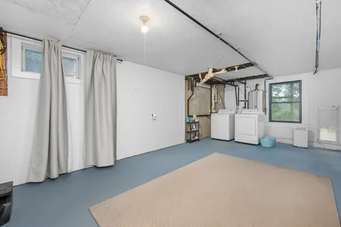 a view of a big room with closet and windows