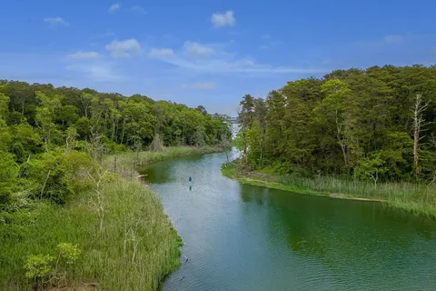 a view of a lake with a building in the background