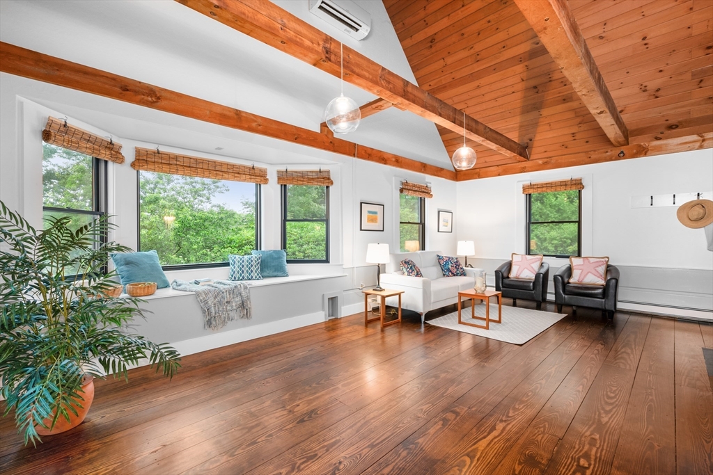 24 Chickadee Circle Chatham, MA 02633 - Photo 5 of 41 a living room with patio furniture and a large window