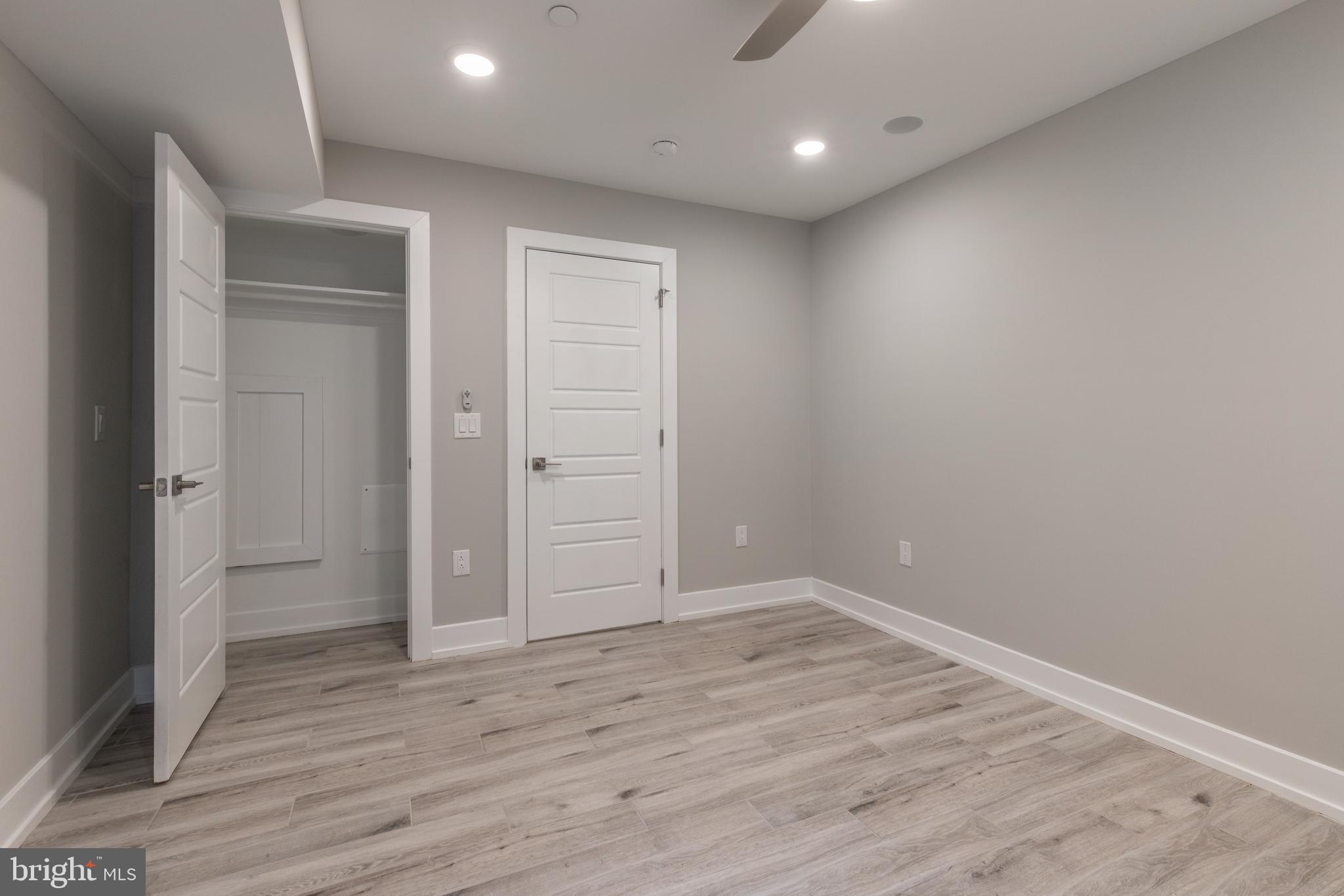 135 West Huntingdon Street, Unit 1 Philadelphia, PA 19133 - Photo 10 of 29 an empty room with wooden floor & closet area